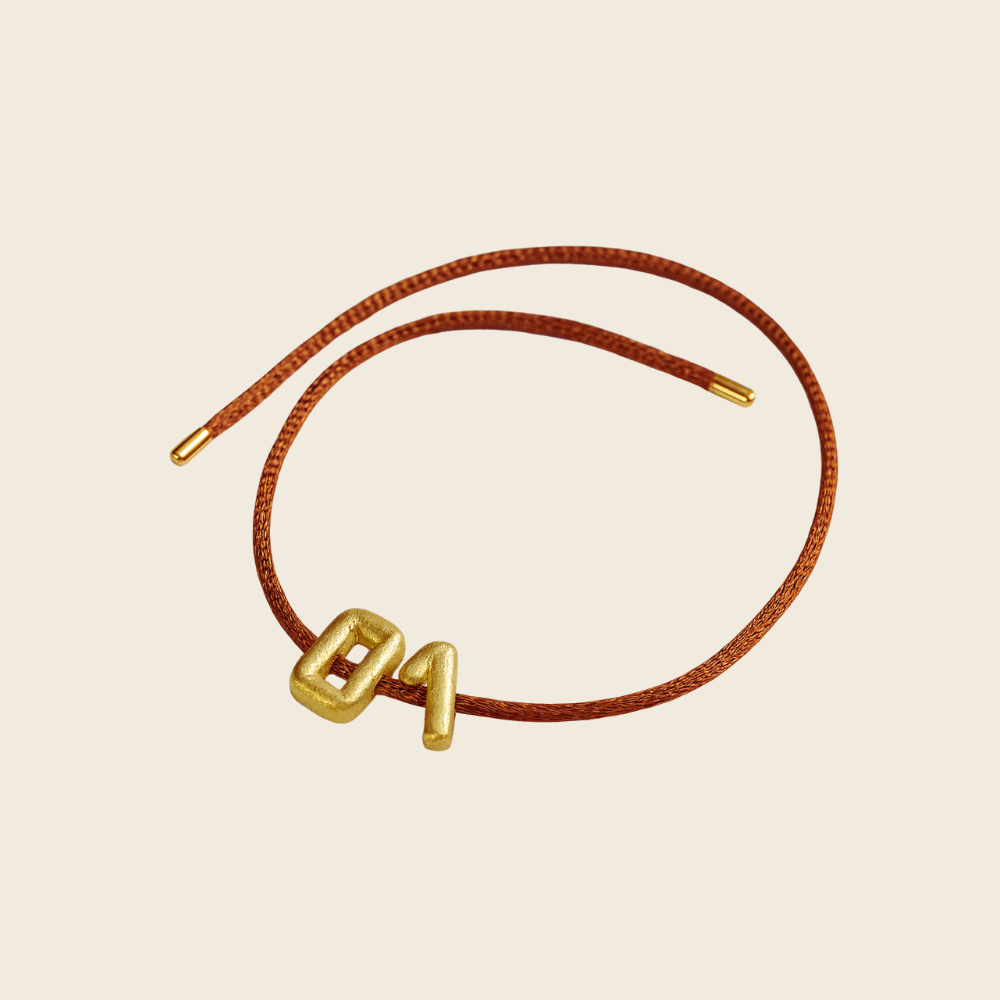 Pulseira Fio Marrom JJ Pontas em Ouro Amarelo 18k